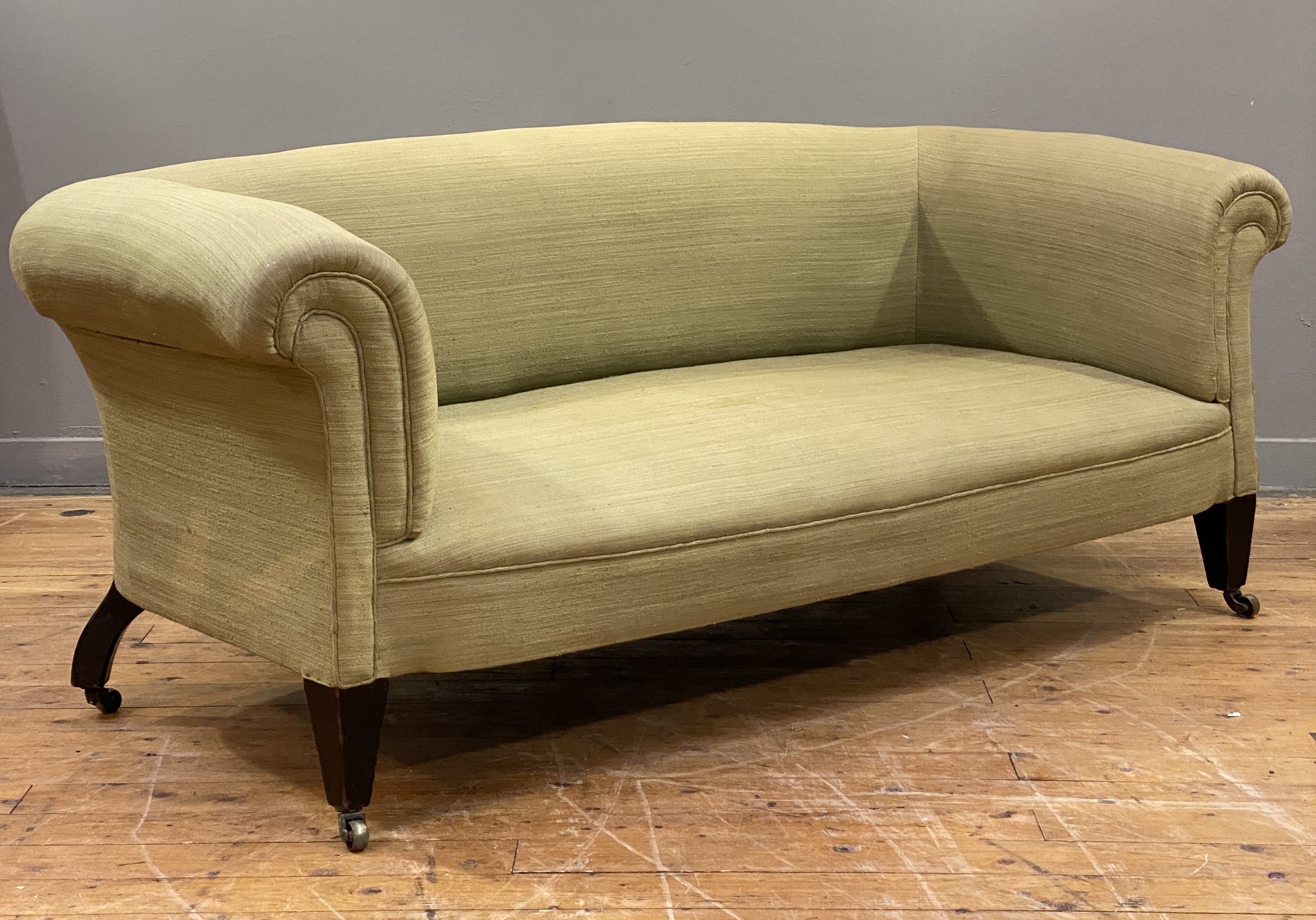 An Irish Chesterfield sofa, third quarter of the 19th century, well upholstered in sage green cotton