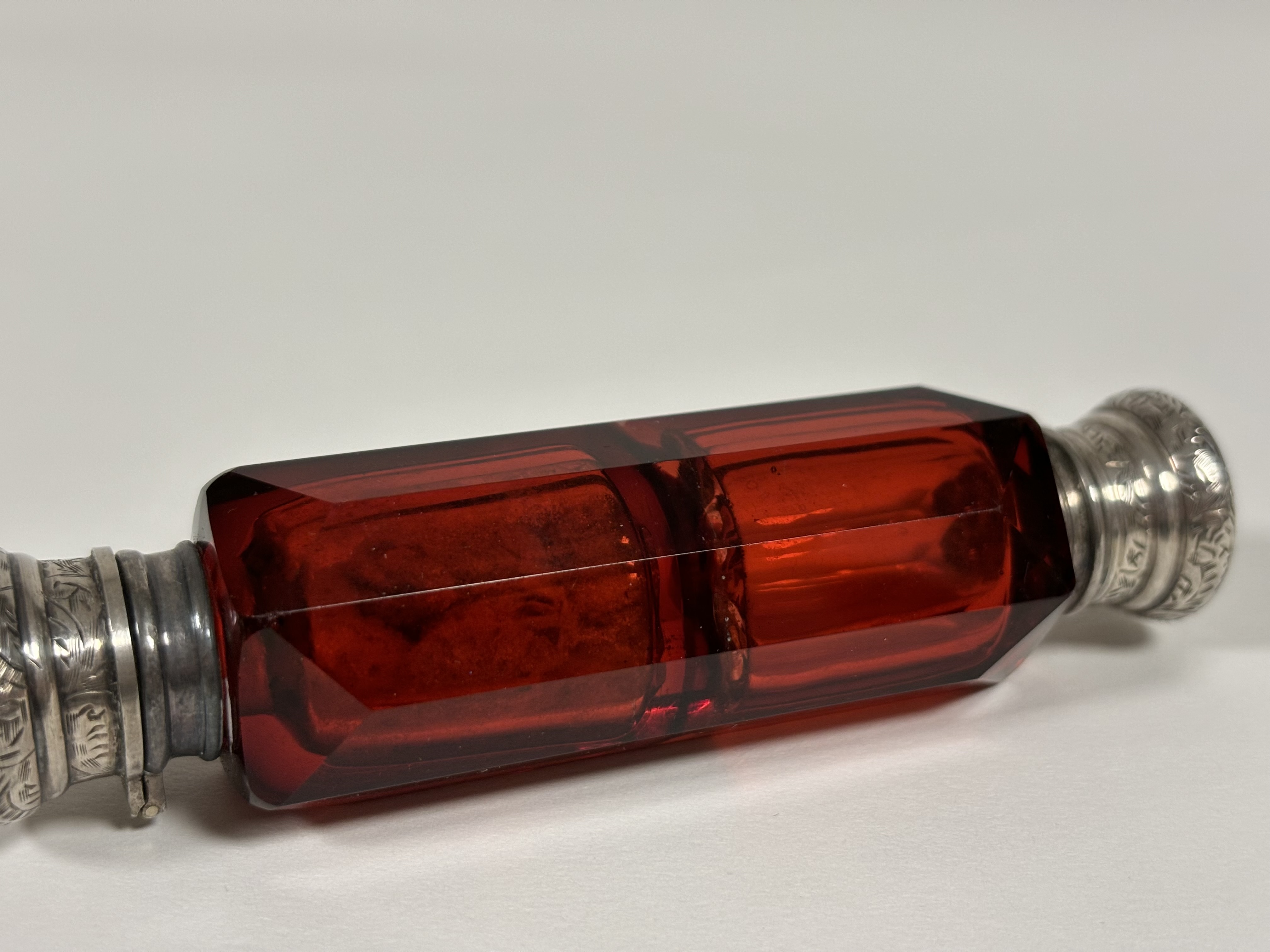 Two late 19th century ruby glass scent bottles: the first double-ended in faceted glass with - Image 7 of 10