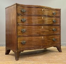 A George III mahogany chest of serpentine outline, the top with boxwood-strung edge above four