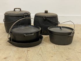 A graduated pair of enamelled metal cooking pots, together with an assortment of pans, cast iron
