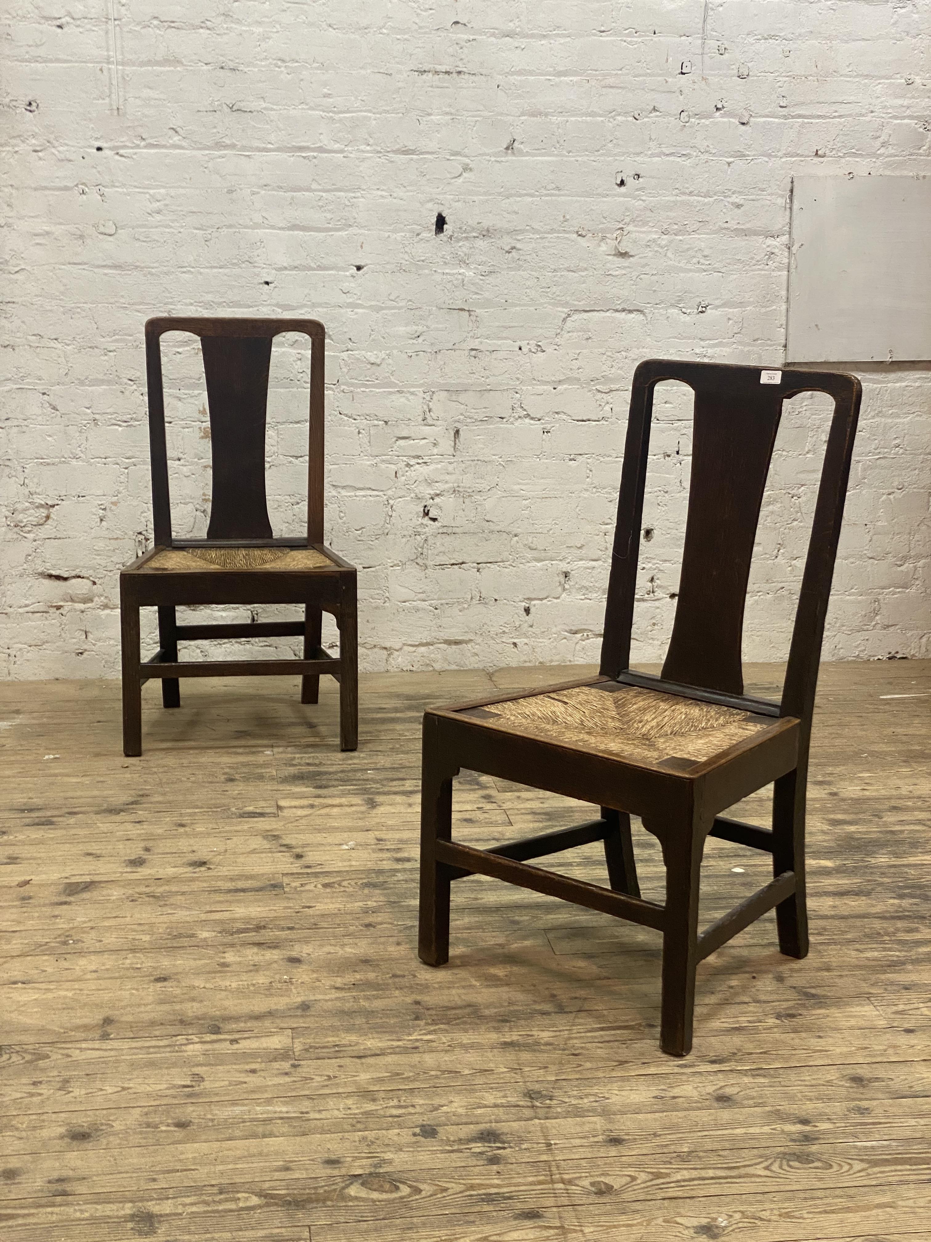 A pair of George III country oak chairs, each with plain splat back over a woven string seat and - Image 2 of 2