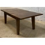 A large stained pine extending dining table, the rectangular top with magic leaf to centre raised on