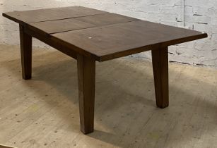 A large stained pine extending dining table, the rectangular top with magic leaf to centre raised on