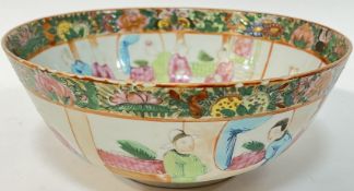 A Qing Dynasty Chinese export porcelain bowl with enamelled panel decoration depicting domestic