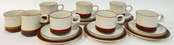 A set of six Denby trios comprising six cups, six saucers, six small plates (w- 17cm), a milk jug,