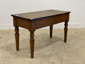 A 19th century mahogany side table, the rectangular top raised on turned supports. (reduced)