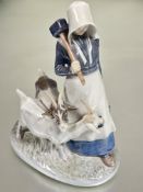 A Danish Royal Copenhagen figure the goat herder dressed in traditional costume holding a hammer