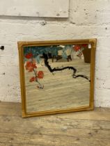 A vintage bamboo wall mirror with reverse painted glass 69cm x 69cm.