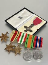 A group of medals to include an MBE cased, together with a WWII group of medal including, an