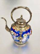 A Chinese Straits style porcelain tea pot with blue ground and floral sprays with white metal mounts