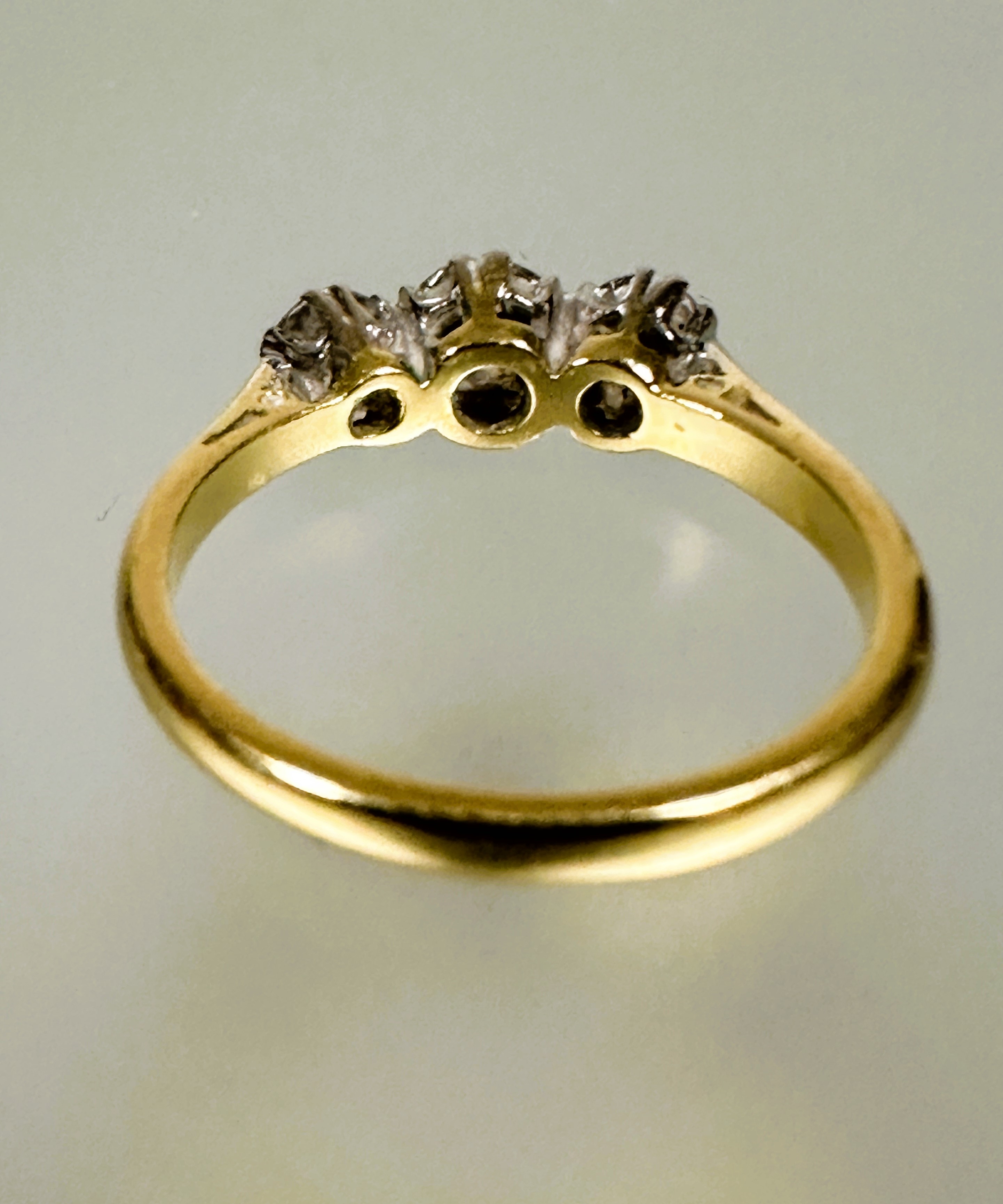 A 18ct gold three stone graduated diamond ring the center stone approximately 0.25ct flanked by 0. - Image 2 of 3