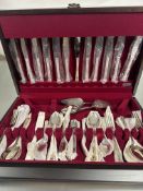 A mahogany canteen containing a suite of Sheffield Epns flatware for six place settings to