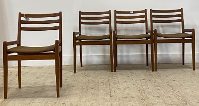 A set of four mid century teak dining chairs, with ladder backs, upholstered seats and raised on