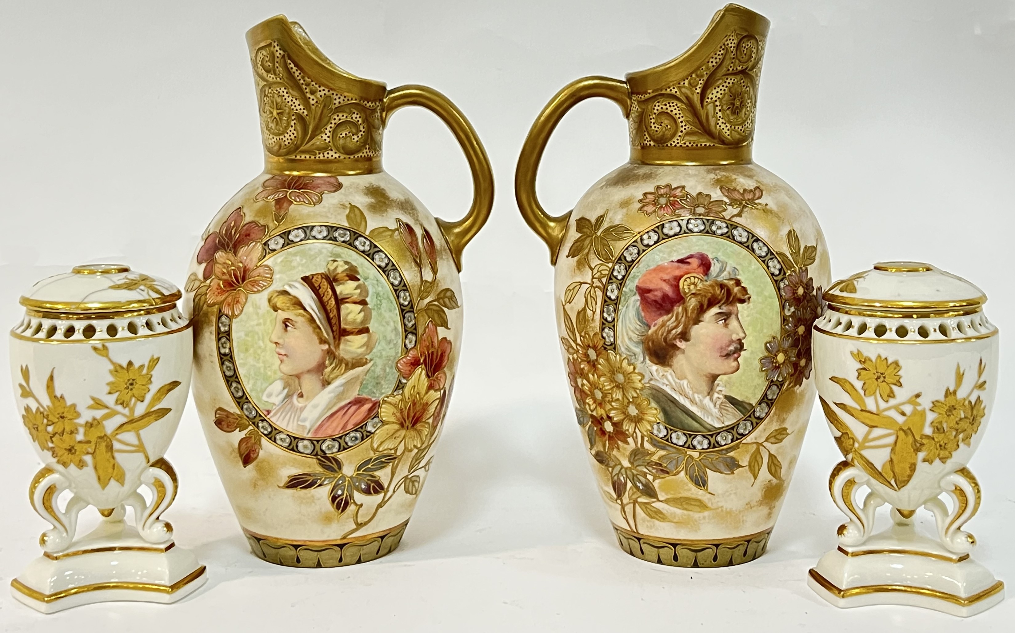 A pair of Doulton Burslem blushed ivory gilt and enamelled portrait jugs (restores, h- 22cm),