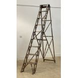 A set of pine nine rung decorators step ladders, early to mid 20th century.