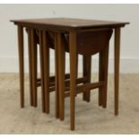 A mid century teak nest of tables in the manner of Poul Hundevad. H54cm.