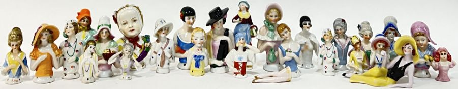 A large quantity of half-doll china lady pin cushions/figures, mostly German, including Art Deco and