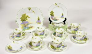 An Aynsley 1920's Bluebell time pattern with green rim part tea service comprising, a serving