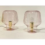 A pair of contemporary moulded glass table lamps. H28cm.