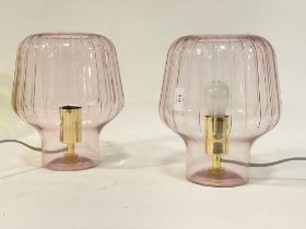 A pair of contemporary moulded glass table lamps. H28cm.