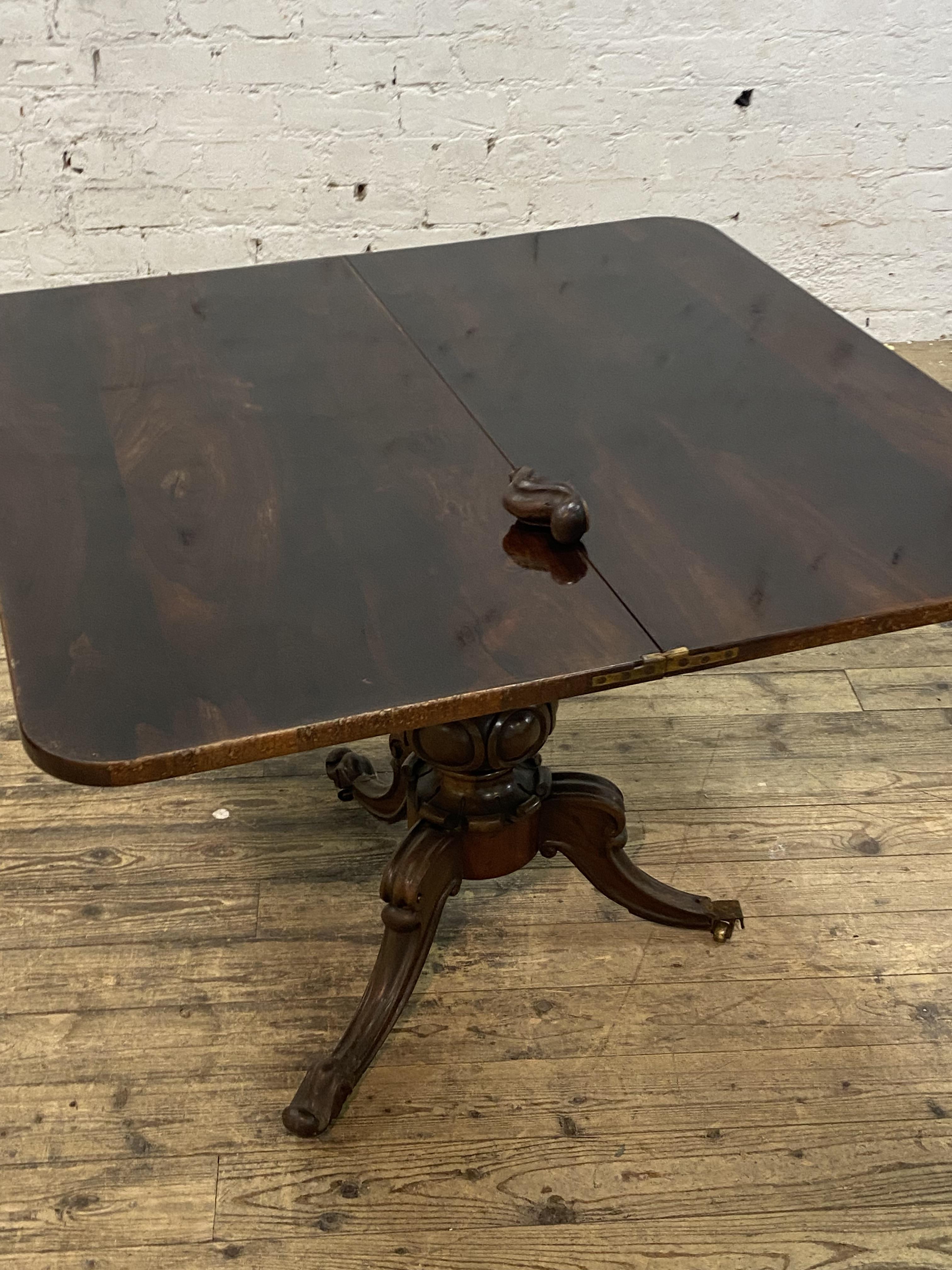 An early Victorian rosewood fold over tea table, the rectangular top above a plain frieze, raised on - Image 3 of 3
