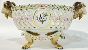 After a design by Johann Carl Schonheit, a Meissen porcelain ram's head openwork bowl, the