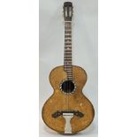 A vintage spruce and rosewood acoustic guitar, the tailpiece marked Dreima, the sound hole with