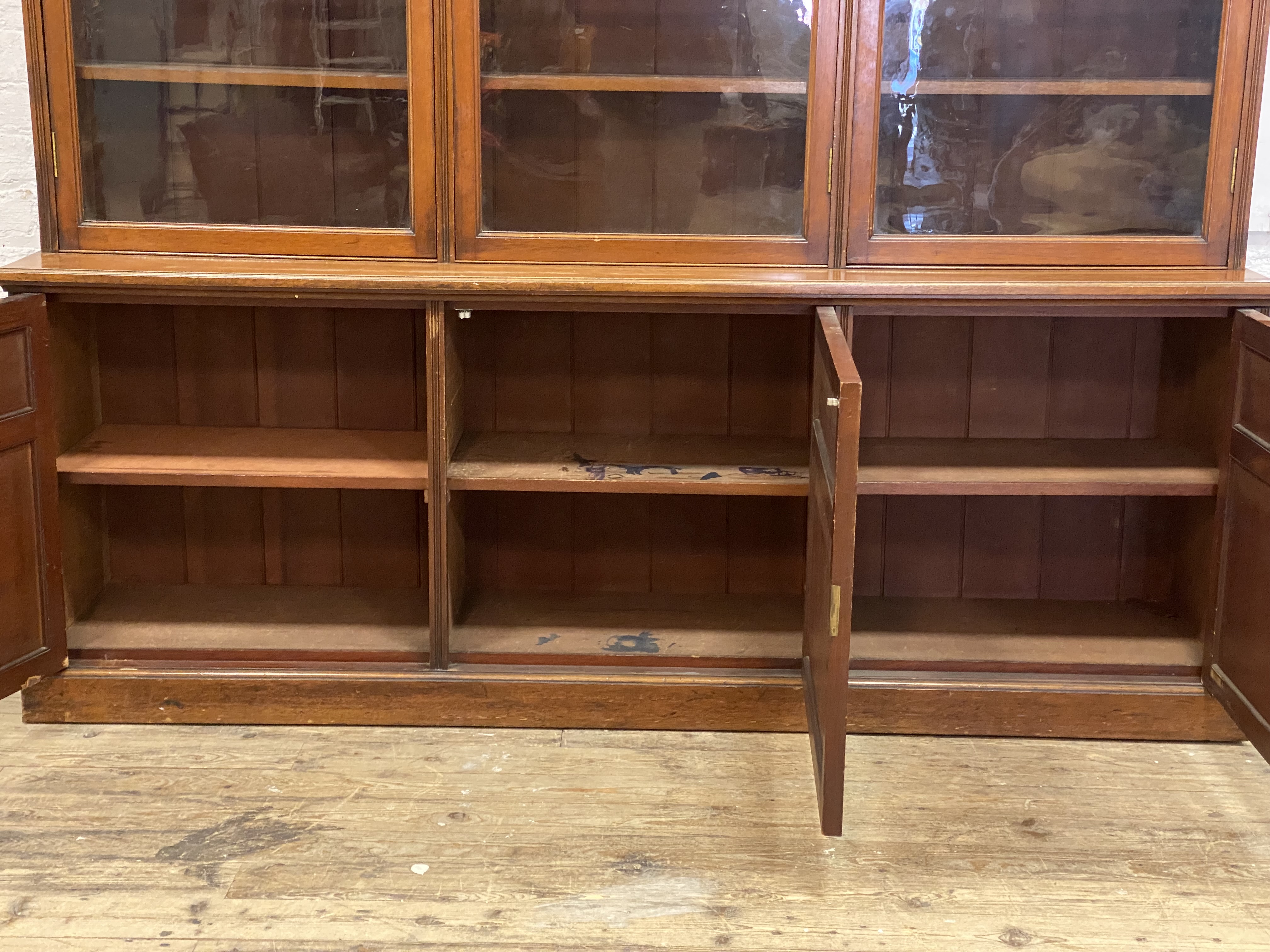 A Edwardian law office mahogany two part bookcase, the projecting cornice above figured frieze and - Image 2 of 2