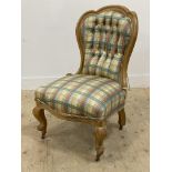 A Victorian bedroom chair, the bleached walnut show frame enclosed back and seat upholstered in