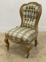 A Victorian bedroom chair, the bleached walnut show frame enclosed back and seat upholstered in