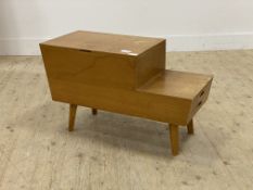 A mid century oak veneered stepped sewing box, hinged lid opening to a fitted interior, with a