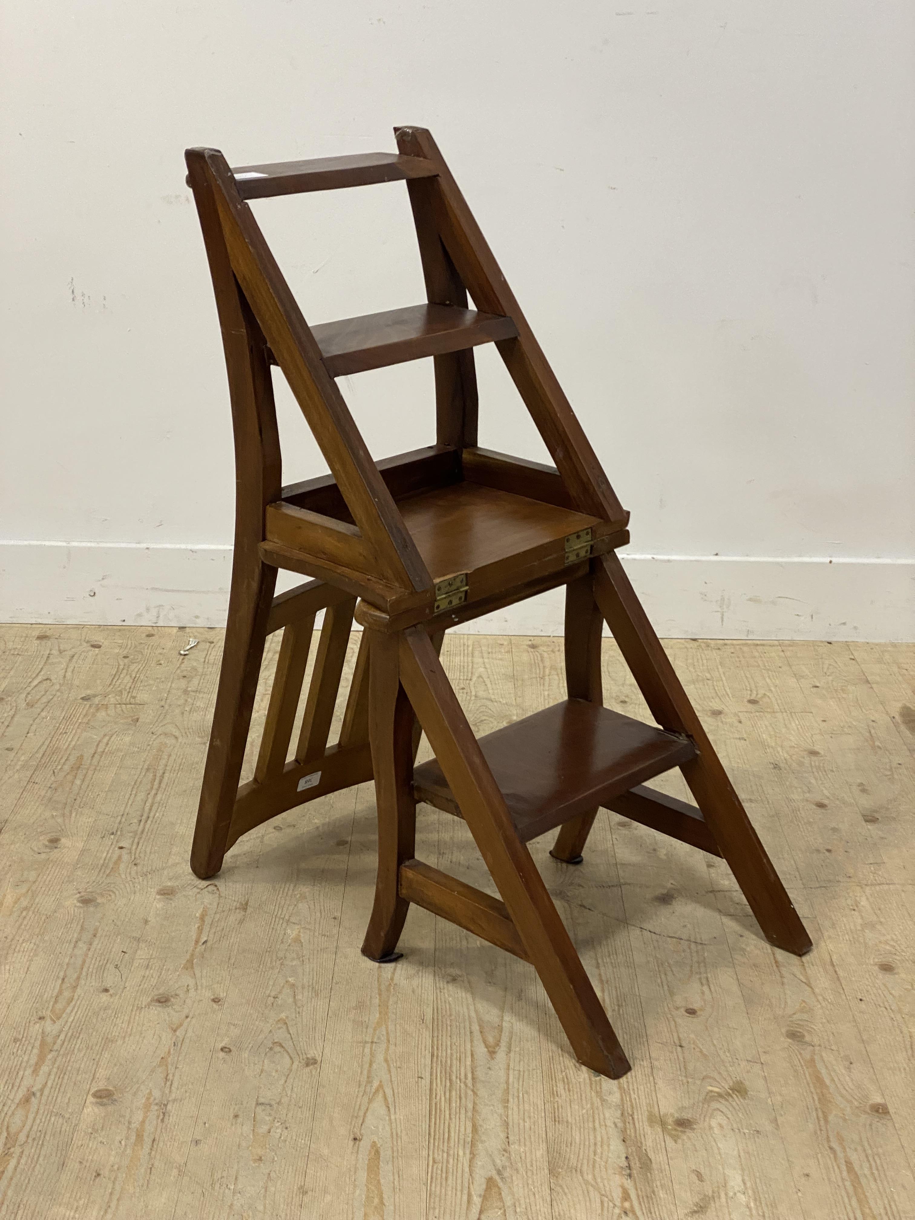 A Walnut metamorphic library chair, the the spar back and shaped seat folding over to a three rung - Image 2 of 2