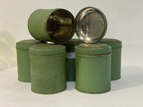 A set of six green toleware kitchen canisters, with hinged lids and stamped Made in England verso.