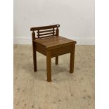A vintage slatted teak bathroom chair with drawer and raised on square section supports. H65cm.