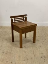 A vintage slatted teak bathroom chair with drawer and raised on square section supports. H65cm.