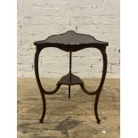 An Edwardian mahogany occasional table, of trefoil outline, the top bordered with conforming 'C'