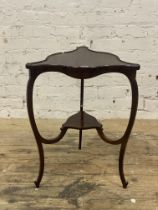 An Edwardian mahogany occasional table, of trefoil outline, the top bordered with conforming 'C'