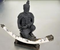 A modern black painted kneeling Chinese Emperors Warrior miniature figure on square base no signs of