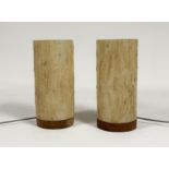 A pair of  hand-made table lamps with textured webbed affect on plastic shades both raised on a