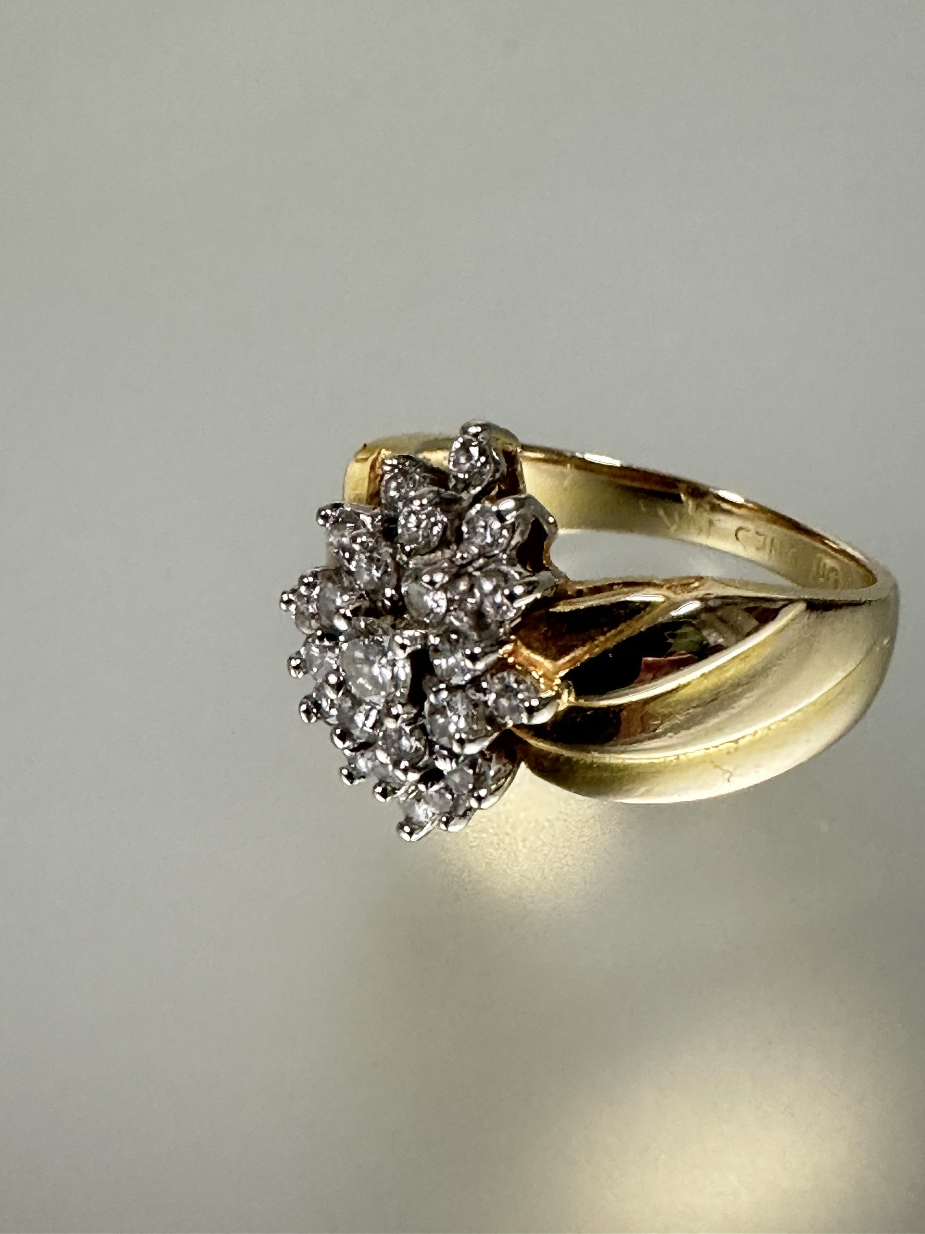 A 14ct gold diamond cluster ring the center brilliant cut stone 0.15ct  within a surround of - Image 2 of 5