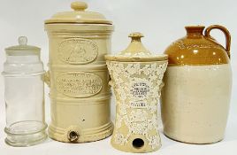 A group of salt-glazed stoneware comprising two water filters (one Lipscombe & Co with sprigg-