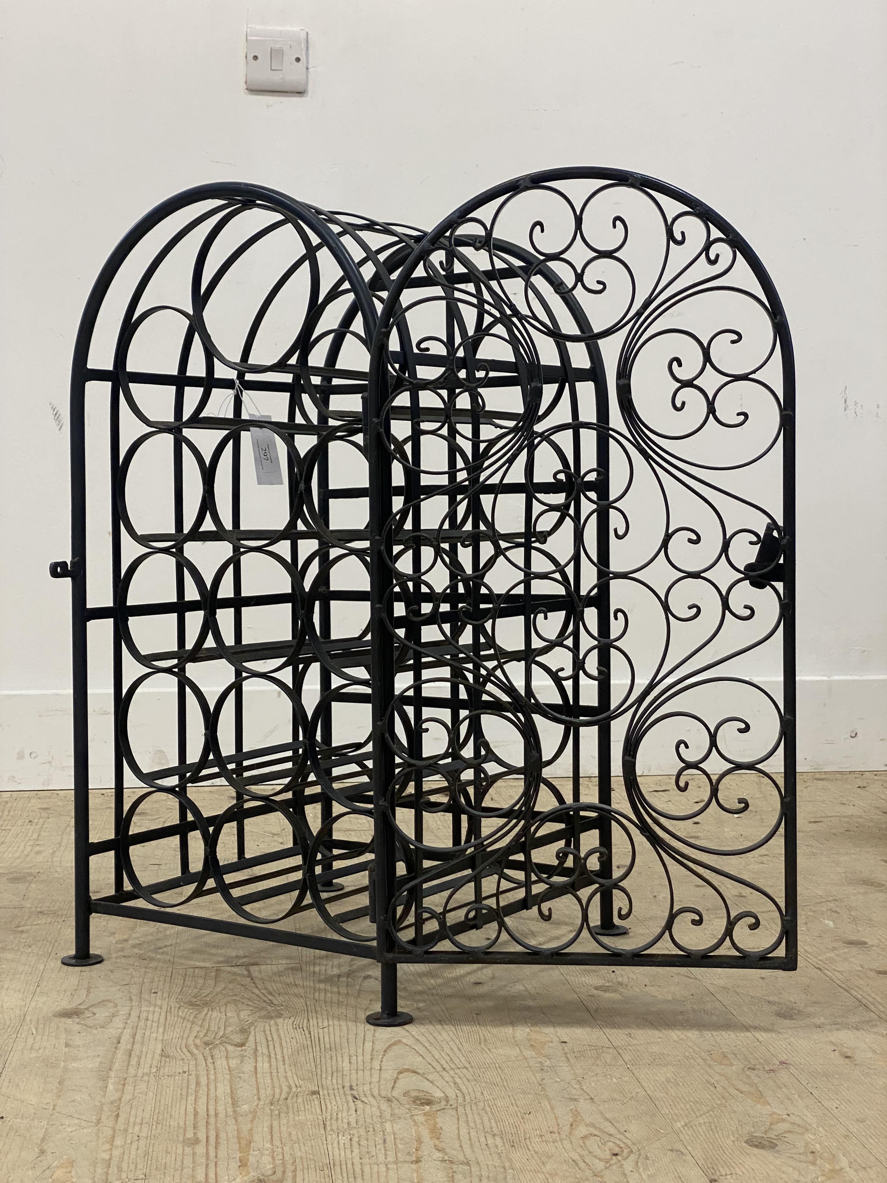 A wrought metal wine rack of arched form, decorated with scrolls. H69cm. - Image 2 of 2