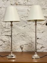 A pair of contemporary chrome plated table lamps, complete with shades. H