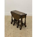 A  small 17th century style oak occasional table, the oval top with twin drop leaves raised on