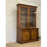 An Edwardian law office two  part mahogany bookcase, the projecting cornice above two glazed doors