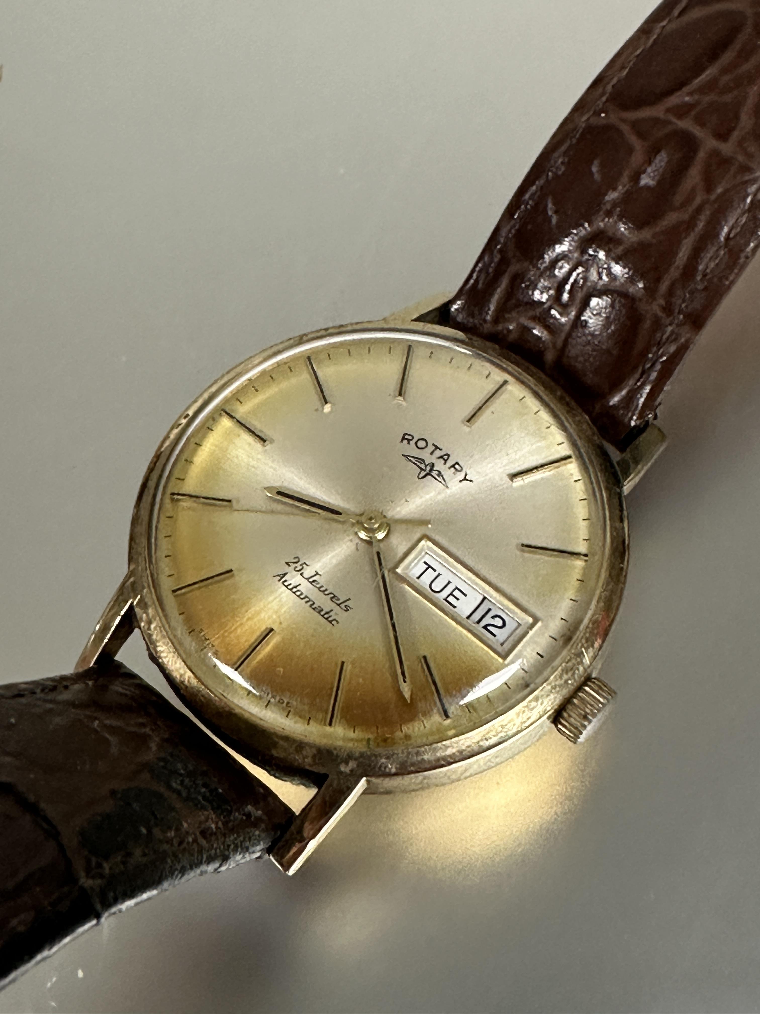 A 9ct gold gents automatic Rotary wrist watch with day and date complication and baton hour