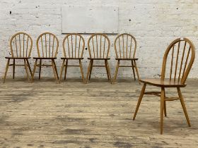 Ercol, a set of six elm and beech dining chairs, hoop and spindle back over saddle seats and