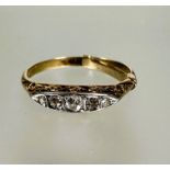 A 18ct gold five old mine cut graduated diamond set ring, the center stone approximately 0.03ct with