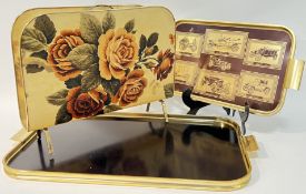 A large black and gold tone tray (w- 63cm), together with a motoring themed tray and a magazine rack