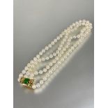 A good white Akoya cultured two strand pearl choker necklace with 14ct gold clip fastening set